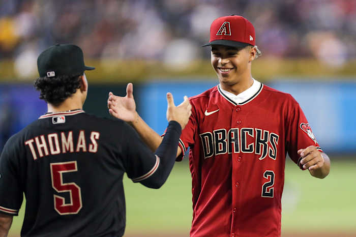 Druw Jones (2) high-fives Alek Thomas (5), while Jones meets all the players on the Diamondbacks big league roster after signing his first professional contract.